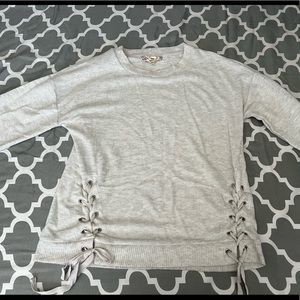 cute silver soft long sleeve shirt with strings on front to adjust if needed